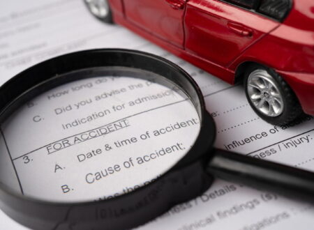 Car Accident Lawsuit showing a damaged vehicle, legal documents, and a judge's gavel representing accident claims and legal action.