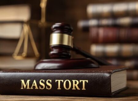 Lawyers reviewing legal documents in a courtroom while representing multiple plaintiffs in a complex Mass Tort Litigation