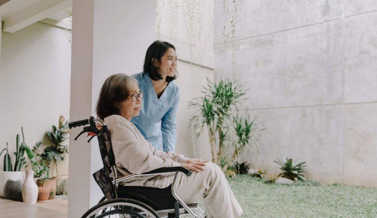 Elderly nursing home resident with family members consulting a lawyer about a nursing home negligence lawsuit over inadequate care and neglect.