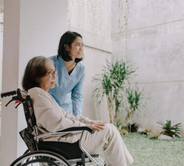 Elderly nursing home resident with family members consulting a lawyer about a nursing home negligence lawsuit over inadequate care and neglect.