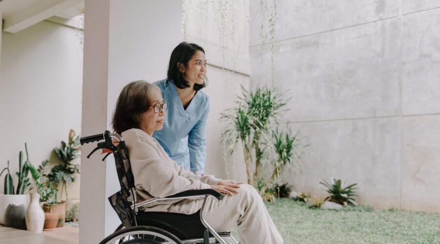 Elderly nursing home resident with family members consulting a lawyer about a nursing home negligence lawsuit over inadequate care and neglect.