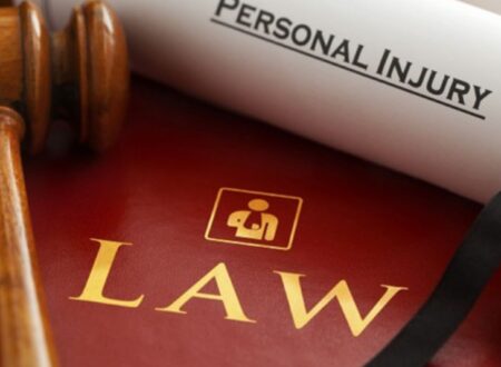 Attorney reviewing documents with an injured client during a consultation about Personal Injury Claims and legal compensation.