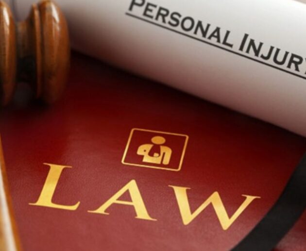 Attorney reviewing documents with an injured client during a consultation about Personal Injury Claims and legal compensation.