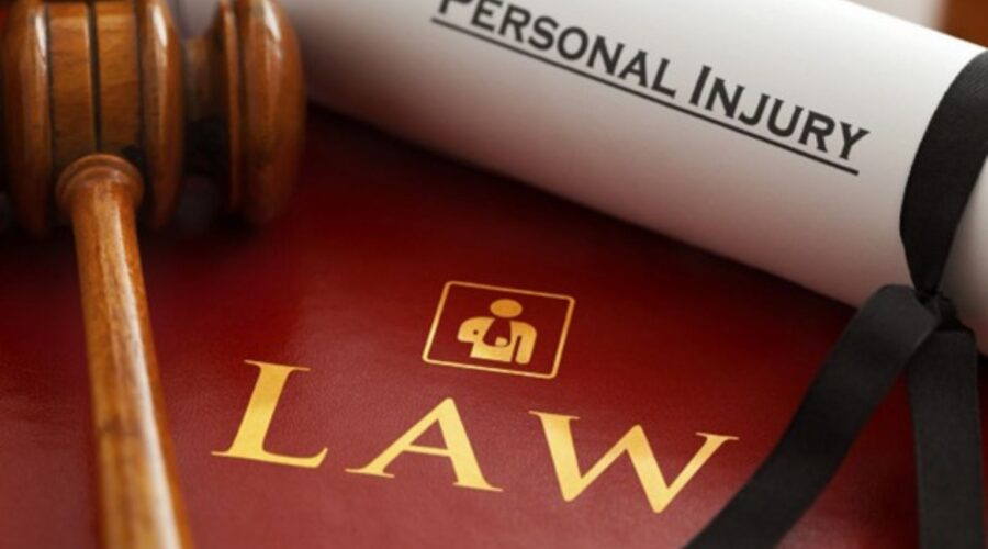 Attorney reviewing documents with an injured client during a consultation about Personal Injury Claims and legal compensation.