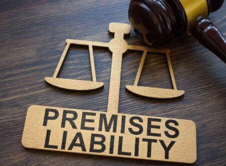 Premises liability cases concept showing a person slipping and falling on a wet floor inside a commercial property, with a warning sign nearby and a legal document in the background.