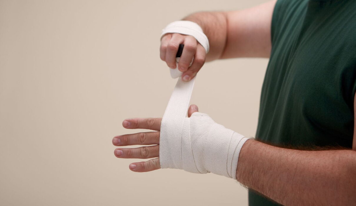 Employee meeting with a lawyer to discuss a workplace injury lawsuit after a job-related accident.