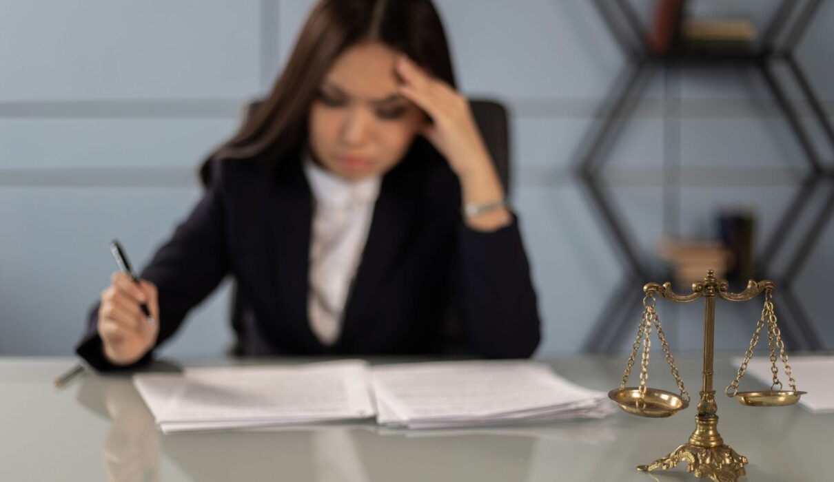 Employee discussing workplace retaliation cases with an attorney after reporting discrimination or wrongful workplace conduct.