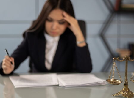 Employee discussing workplace retaliation cases with an attorney after reporting discrimination or wrongful workplace conduct.