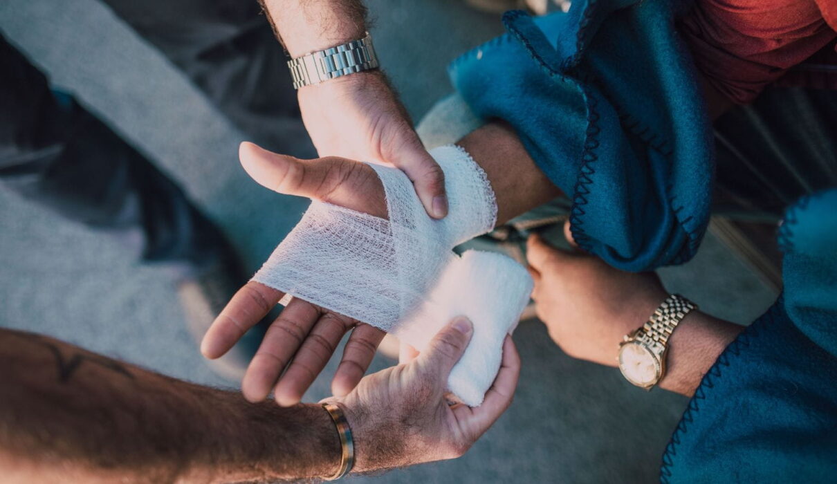 A lawyer reviews legal documents with an injured client during a personal injury case consultation after an accident.