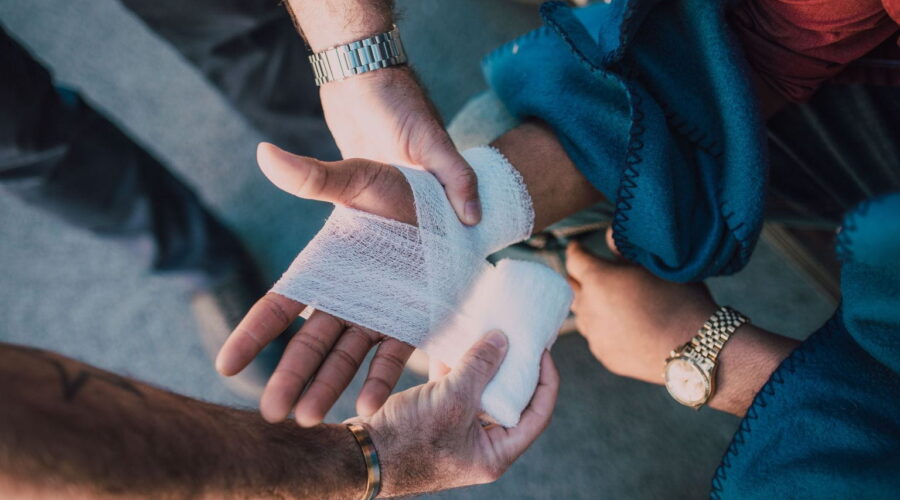 A lawyer reviews legal documents with an injured client during a personal injury case consultation after an accident.