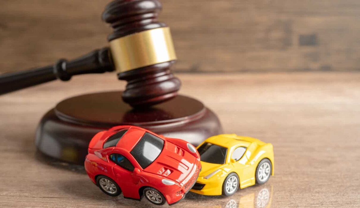 Car Accident Lawsuit involving two damaged vehicles after a serious collision, highlighting a legal claim for injury compensation and insurance disputes.