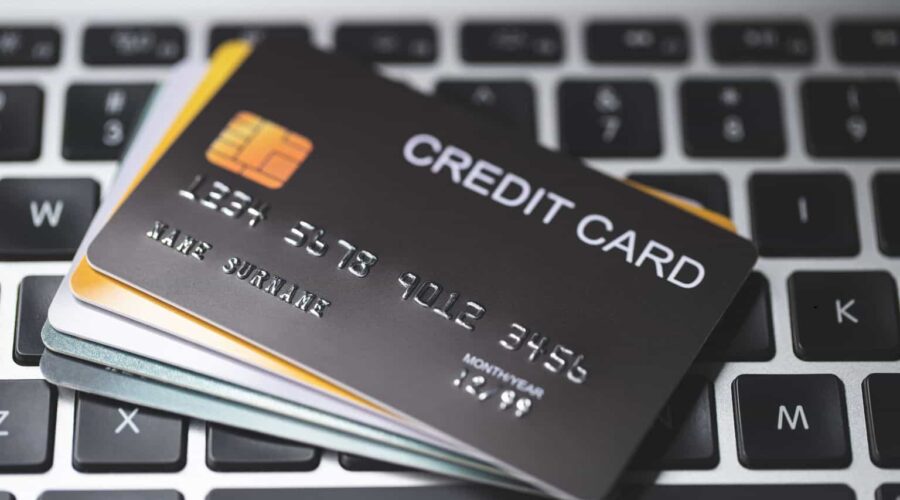 Credit Card Lawsuit showing a consumer reviewing credit card statements and legal documents while consulting with an attorney over a financial dispute.