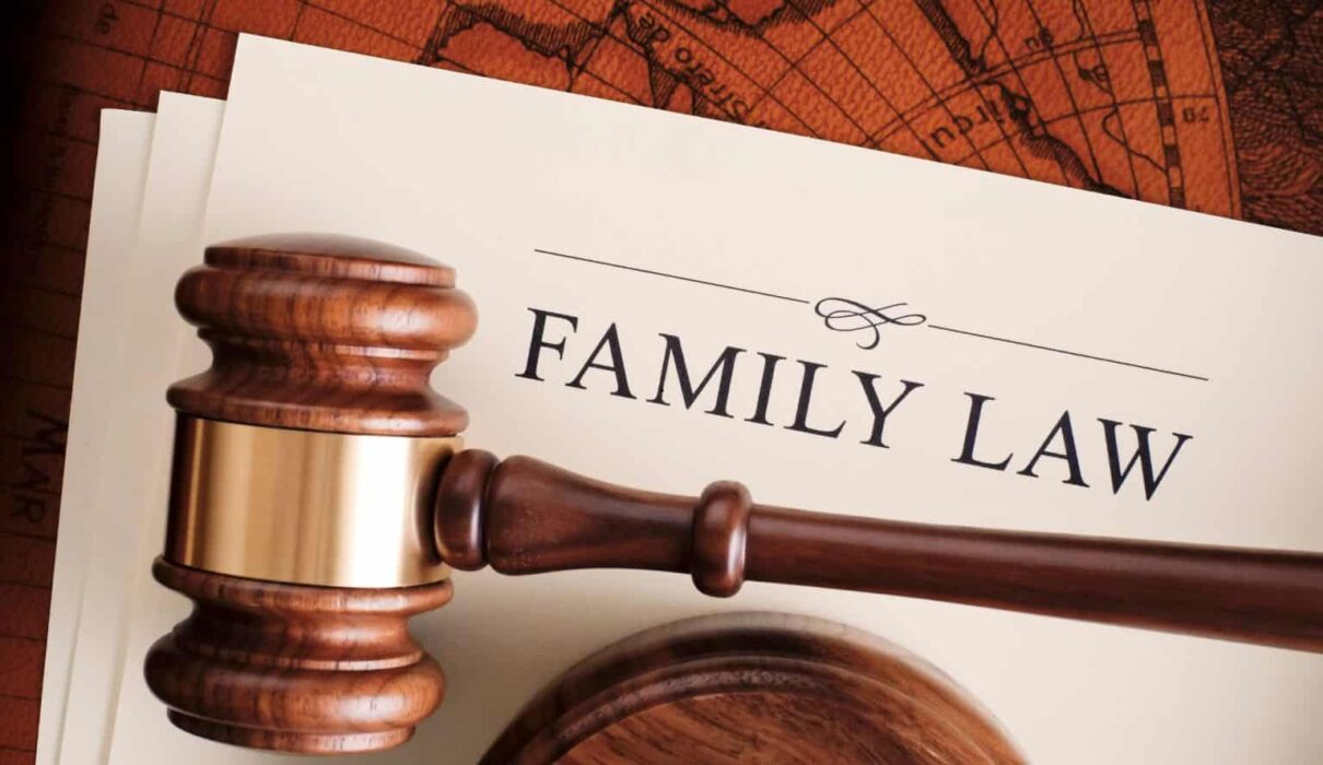 A family meeting with parents and children discussing legal matters with a lawyer, representing Family Law services related to divorce, child custody, adoption, and family rights.