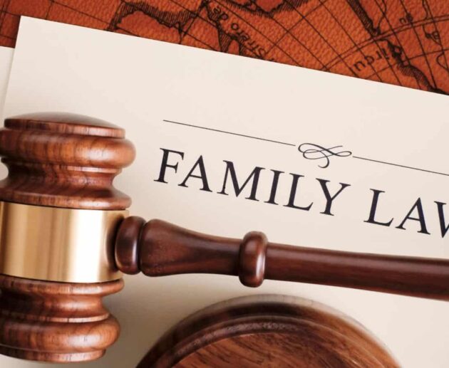 A family meeting with parents and children discussing legal matters with a lawyer, representing Family Law services related to divorce, child custody, adoption, and family rights.