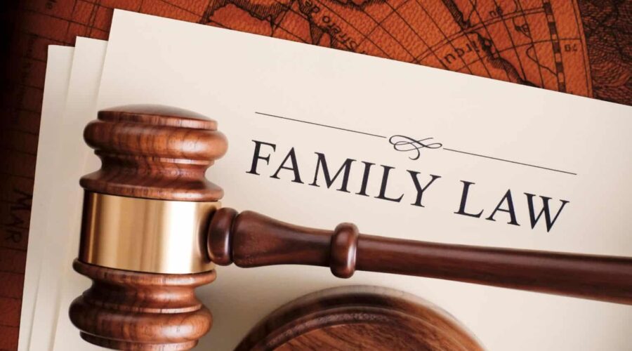 A family meeting with parents and children discussing legal matters with a lawyer, representing Family Law services related to divorce, child custody, adoption, and family rights.