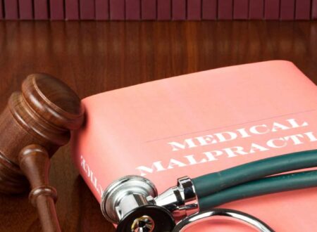 Medical Malpractice Lawsuit consultation between a patient and an attorney reviewing medical records and legal documents related to a healthcare negligence claim.