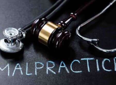 Medical malpractice compensation consultation between an injured patient and attorney reviewing medical records and legal documents.