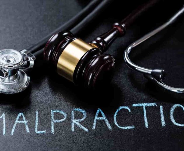 Medical malpractice compensation consultation between an injured patient and attorney reviewing medical records and legal documents.
