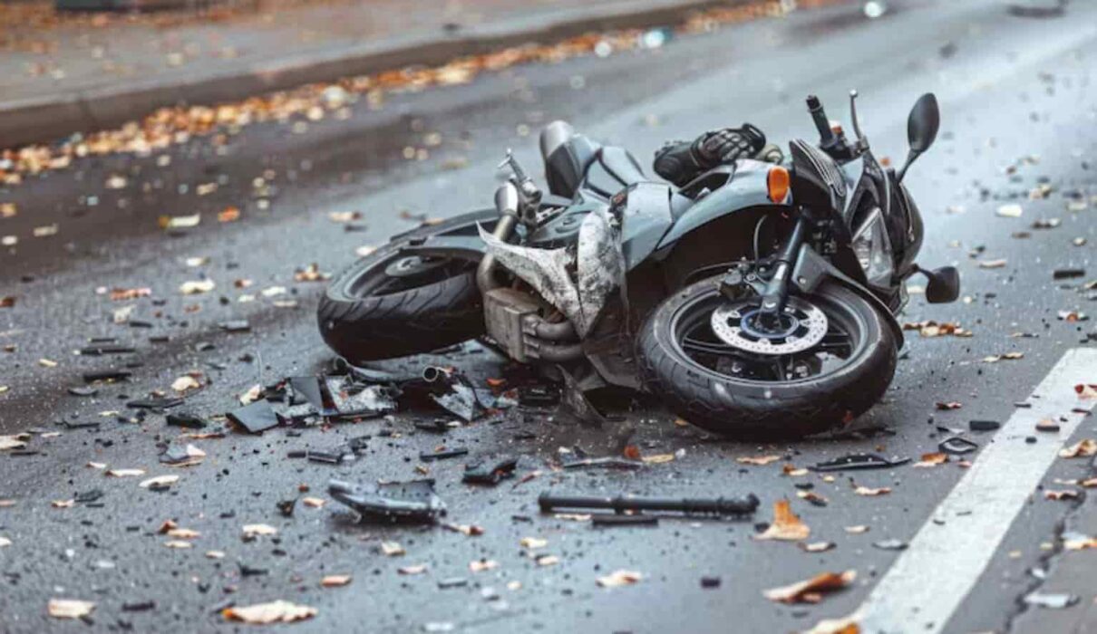 Motorcycle Accident Compensation claim consultation showing an injured rider discussing legal options and financial recovery after a traffic accident.