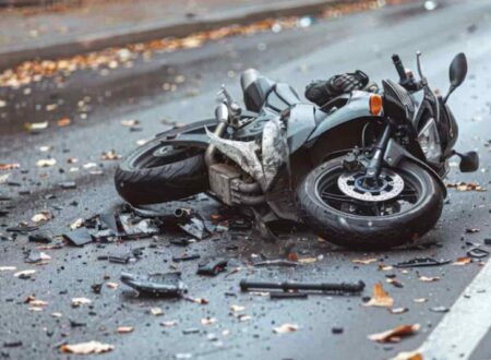 Motorcycle Accident Compensation claim consultation showing an injured rider discussing legal options and financial recovery after a traffic accident.
