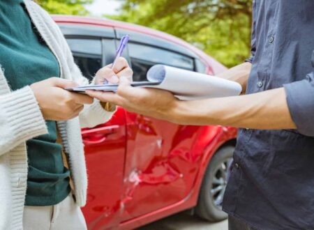 Rideshare Accident Claim involving a damaged rideshare vehicle after a traffic collision, with a passenger reviewing insurance and legal documents.