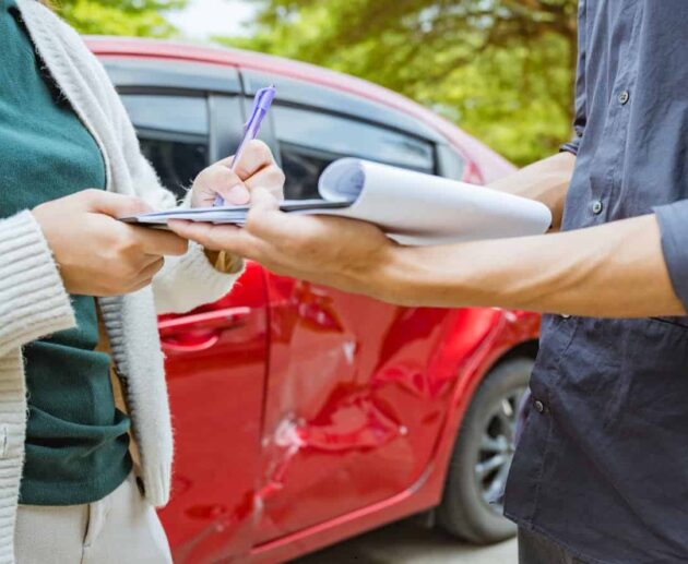 Rideshare Accident Claim involving a damaged rideshare vehicle after a traffic collision, with a passenger reviewing insurance and legal documents.