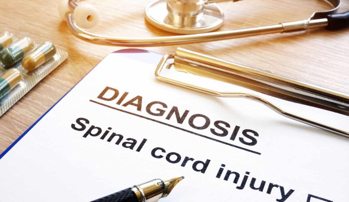 A person undergoing rehabilitation after a serious accident, highlighting Spinal Cord Injury Claims and the legal process of seeking compensation for long-term medical care and recovery.