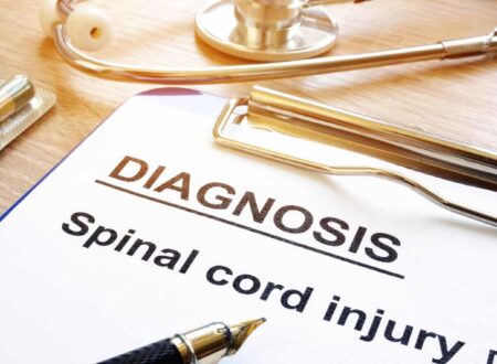 A person undergoing rehabilitation after a serious accident, highlighting Spinal Cord Injury Claims and the legal process of seeking compensation for long-term medical care and recovery.
