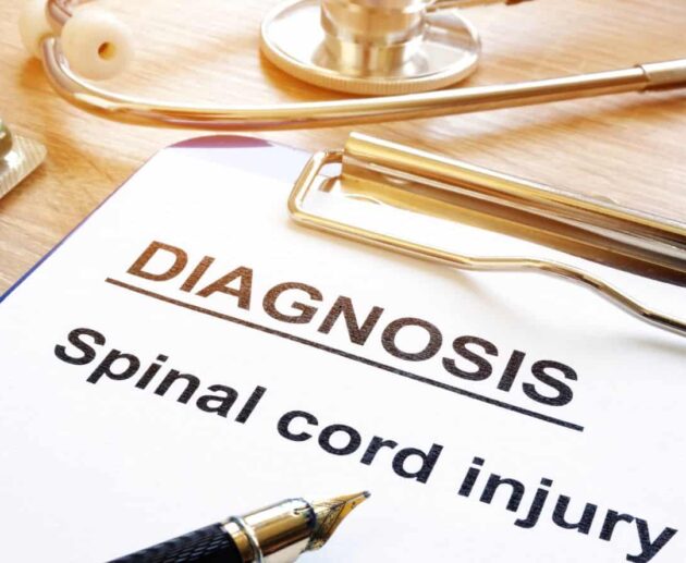 A person undergoing rehabilitation after a serious accident, highlighting Spinal Cord Injury Claims and the legal process of seeking compensation for long-term medical care and recovery.
