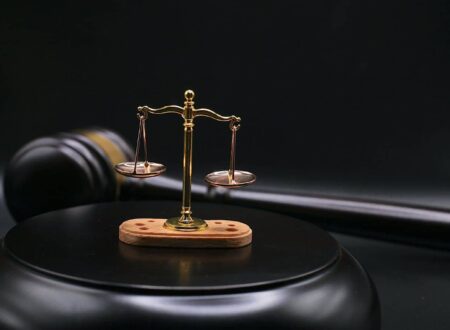 Wrongful Death Lawsuits concept showing a grieving family consulting with a lawyer while reviewing legal documents related to a fatal accident compensation claim.