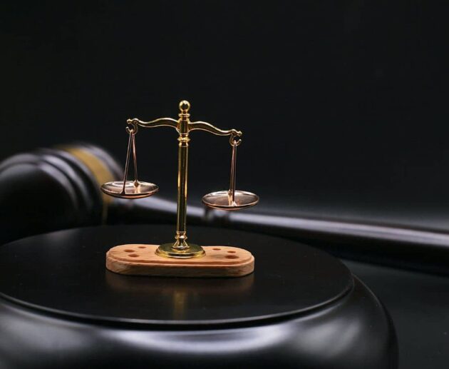 Wrongful Death Lawsuits concept showing a grieving family consulting with a lawyer while reviewing legal documents related to a fatal accident compensation claim.