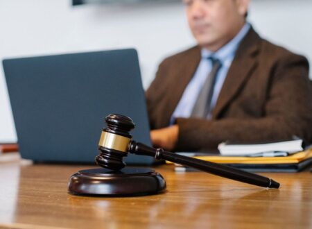 Illustration depicting a HexClad lawsuit with a gavel, legal documents, and cookware products representing consumer protection and product claims.