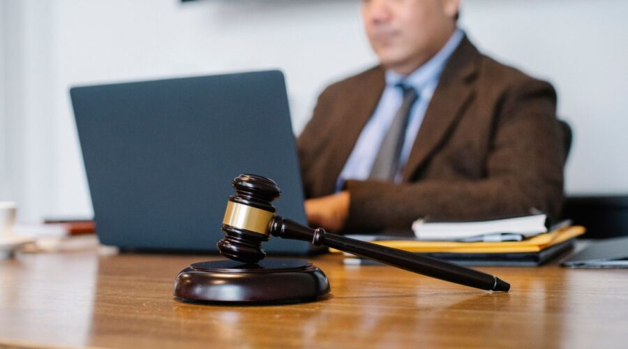 Illustration depicting a HexClad lawsuit with a gavel, legal documents, and cookware products representing consumer protection and product claims.