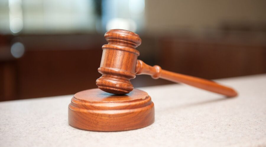 Illustration depicting the Isotonix lawsuit, featuring dietary supplement products, legal documents, a judge's gavel, and consumer protection concerns.