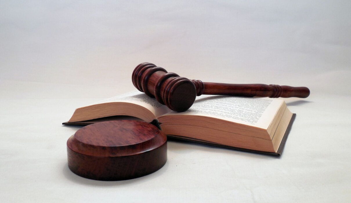 Illustration representing the Janice Griffith lawsuit with a courtroom setting, legal documents, and a judge's gavel symbolizing legal proceedings and liability concerns.