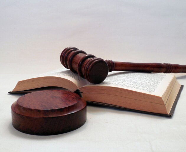Illustration representing the Janice Griffith lawsuit with a courtroom setting, legal documents, and a judge's gavel symbolizing legal proceedings and liability concerns.