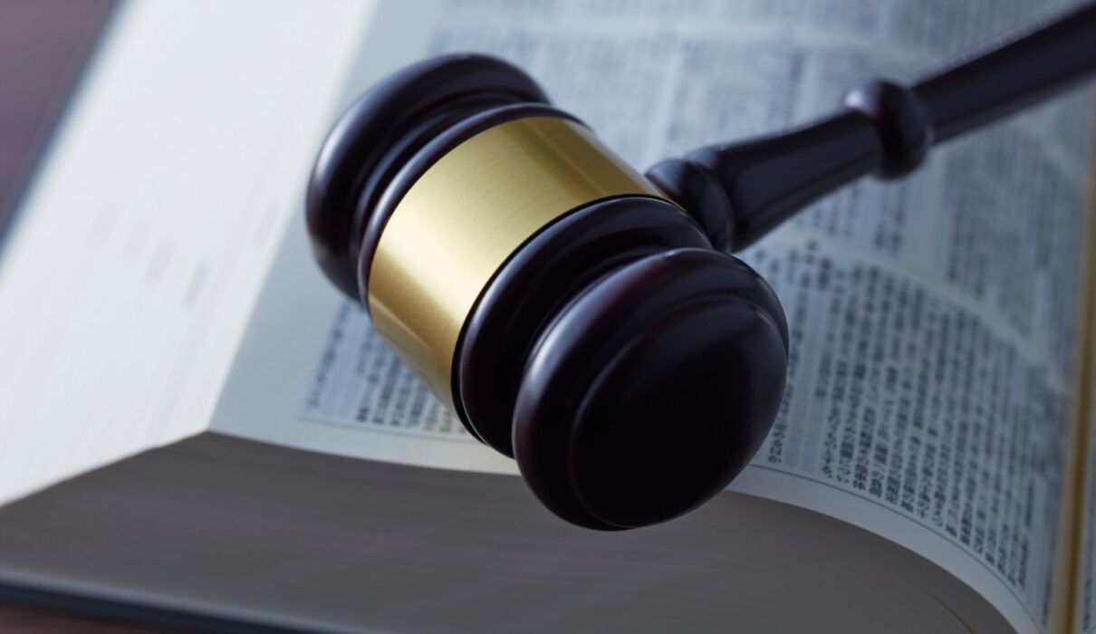 Method Body Wash lawsuit illustration featuring product bottle, legal documents, and courthouse imagery