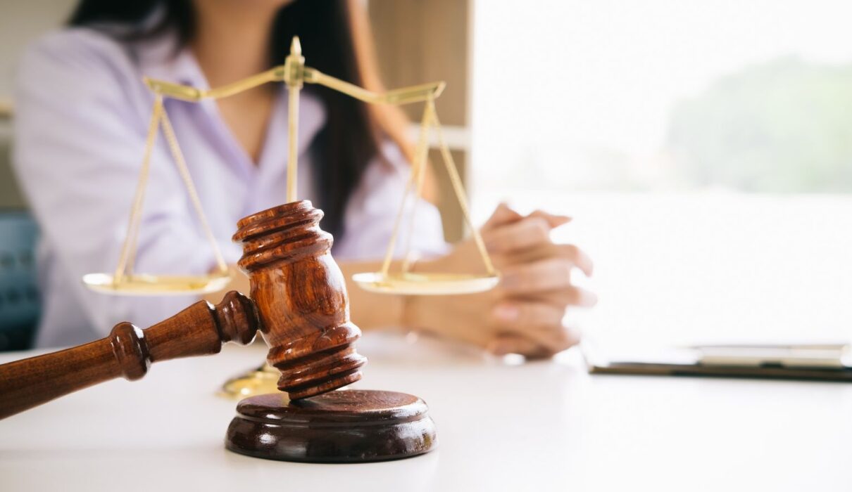 Native shampoo bottle displayed alongside legal documents and a judge's gavel, representing the Native Shampoo lawsuit and consumer product litigation.