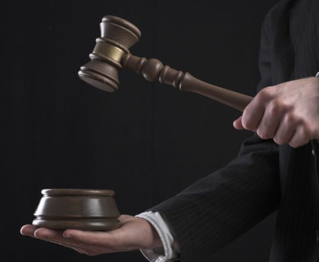 Illustration representing the Omega XL lawsuit with supplement bottles, legal documents, and a courthouse symbolizing consumer protection claims.