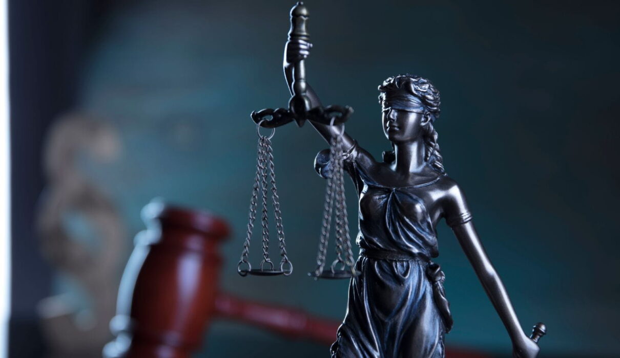 What Is Battery in Law illustration showing one person intentionally making unlawful physical contact with another to explain the legal concept of battery.