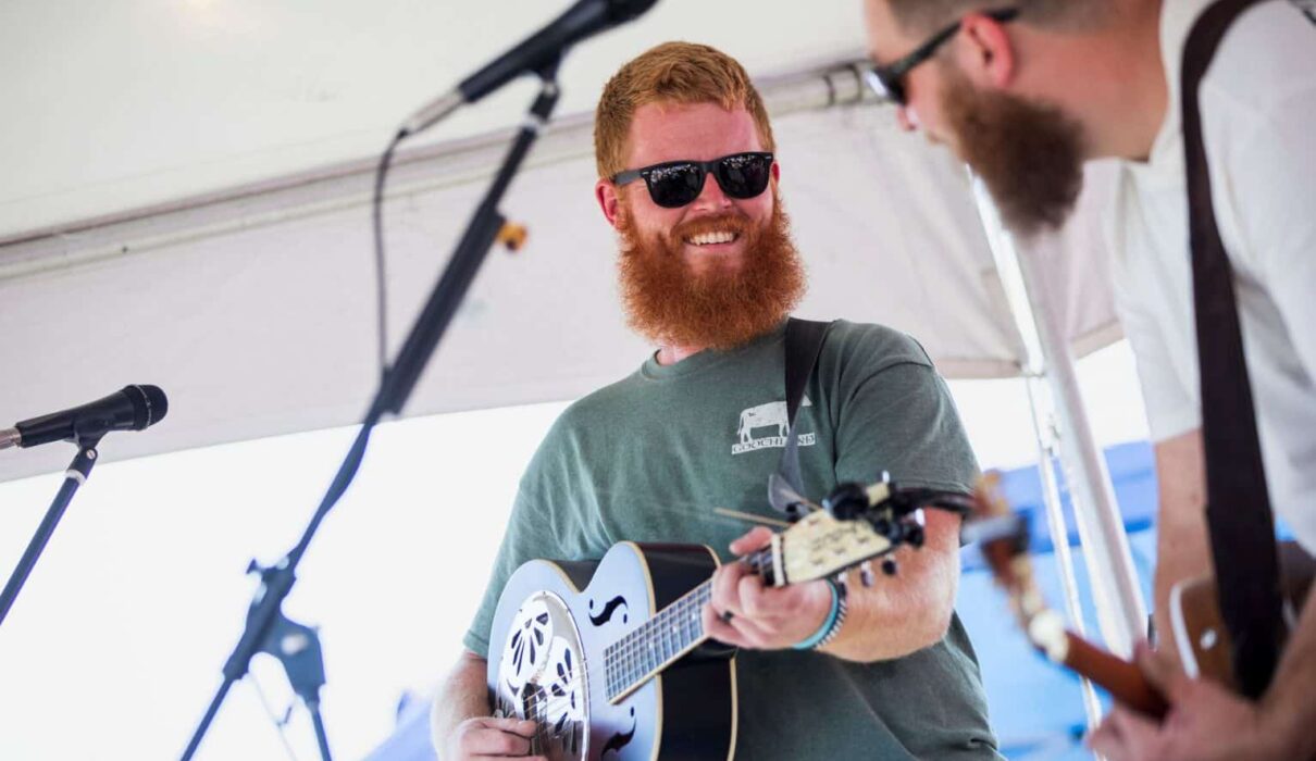 Oliver Anthony performing on stage, country folk singer known for Rich Men North of Richmond