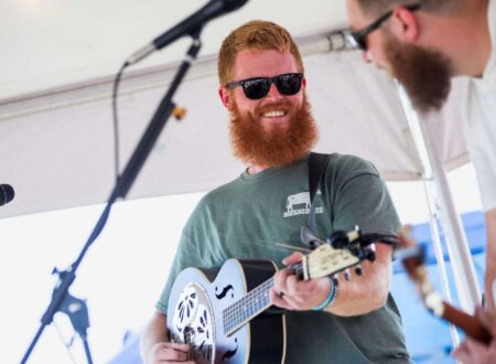 Oliver Anthony performing on stage, country folk singer known for Rich Men North of Richmond