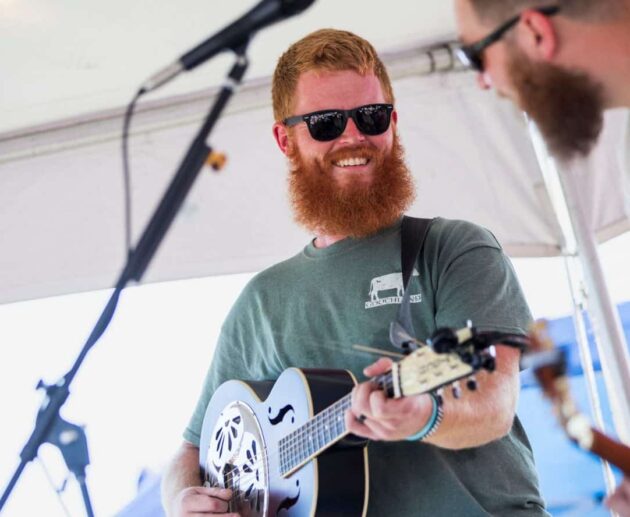 Oliver Anthony performing on stage, country folk singer known for Rich Men North of Richmond