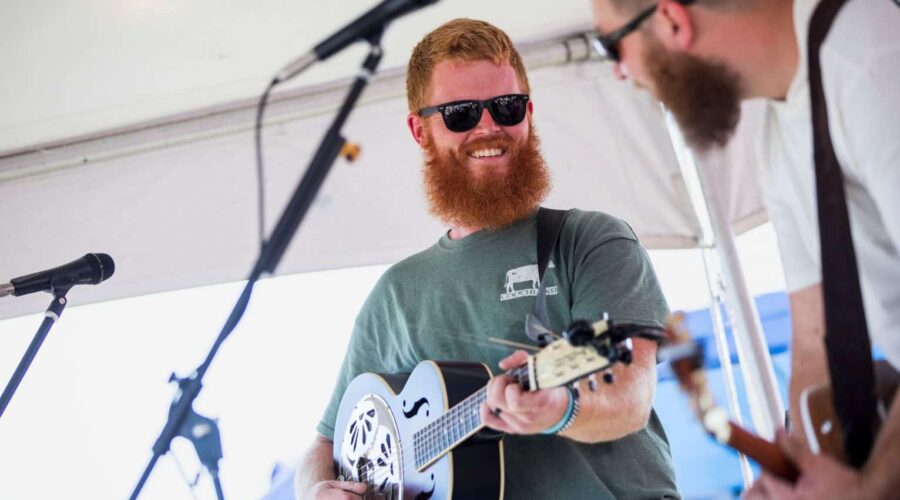 Oliver Anthony performing on stage, country folk singer known for Rich Men North of Richmond
