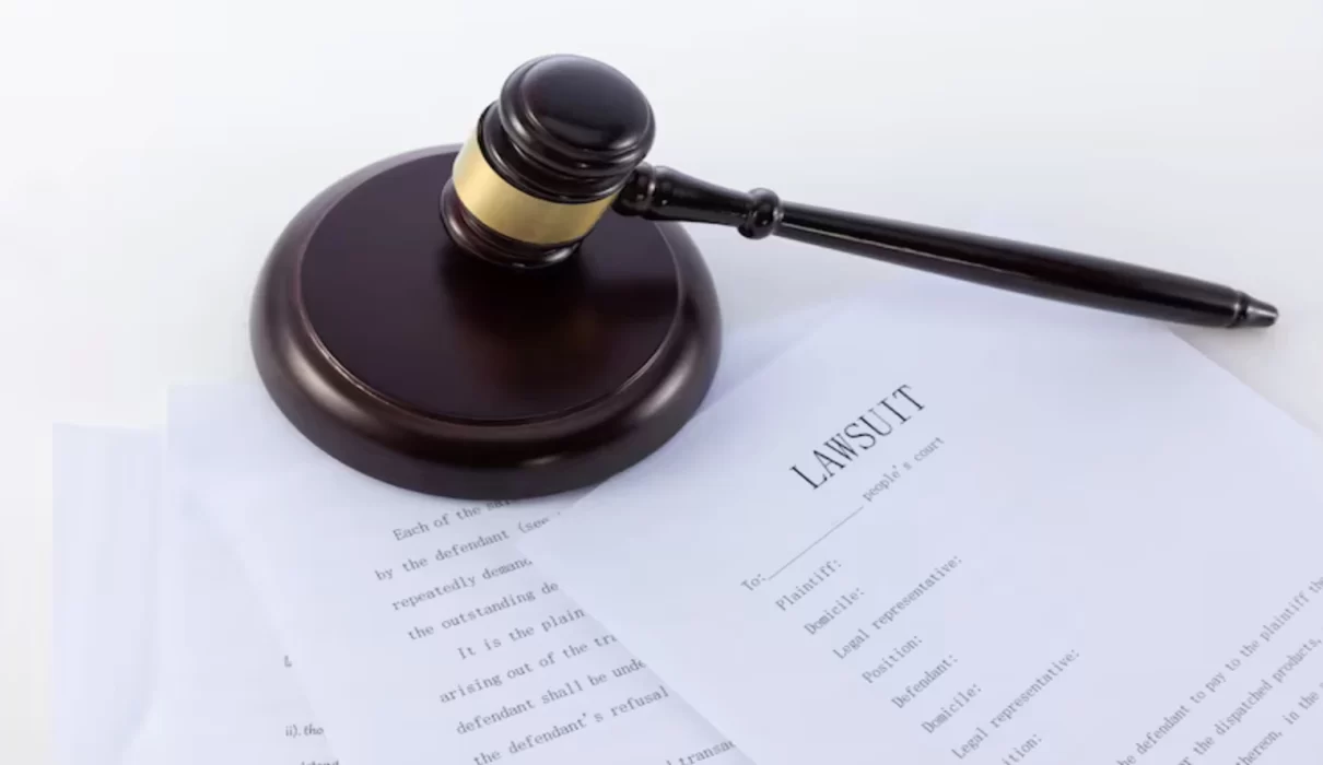 Gavel and legal documents representing the Roundup lawsuit and Bayer settlement proceedings