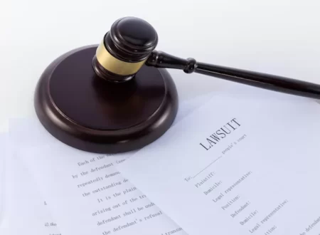 Gavel and legal documents representing the Roundup lawsuit and Bayer settlement proceedings