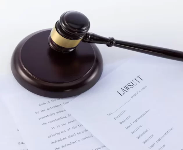 Gavel and legal documents representing the Roundup lawsuit and Bayer settlement proceedings