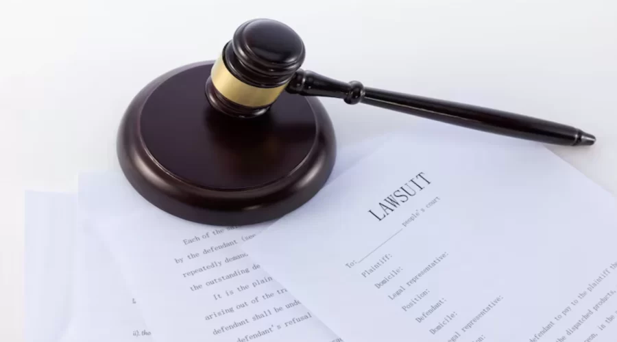 Gavel and legal documents representing the Roundup lawsuit and Bayer settlement proceedings