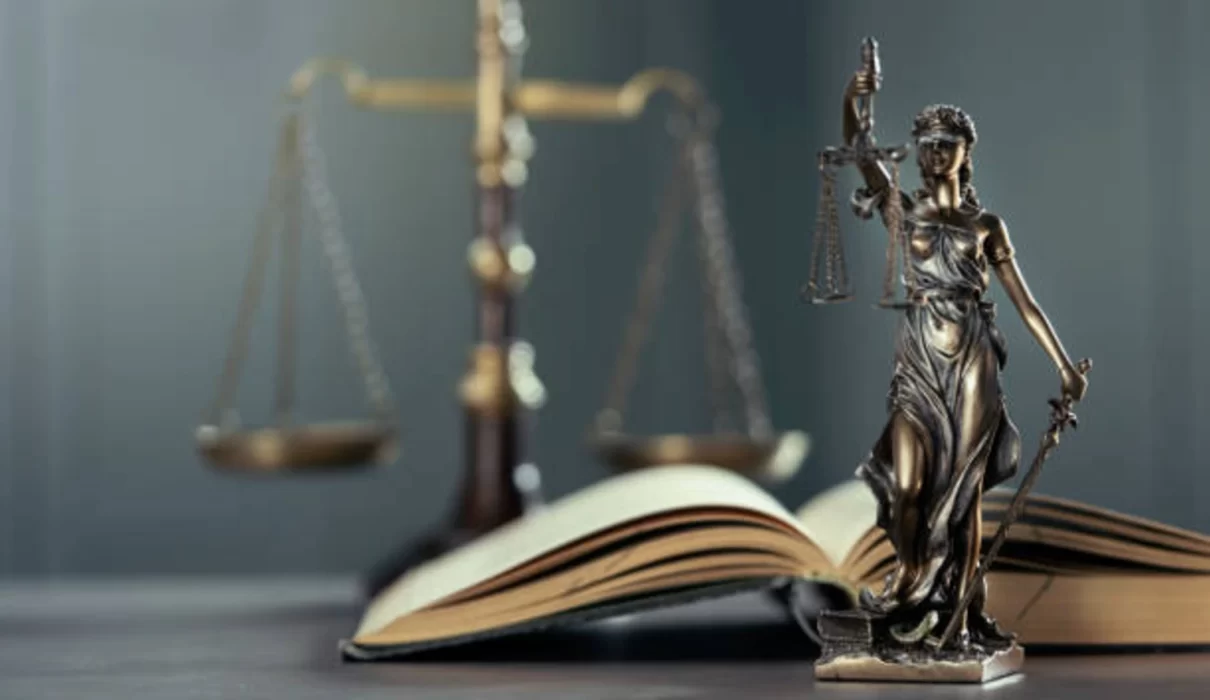 Gavel and legal documents beside a bottle of paraquat herbicide, representing the Paraquat Lawsuit