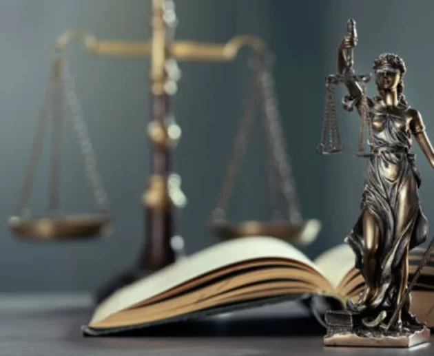 Gavel and legal documents beside a bottle of paraquat herbicide, representing the Paraquat Lawsuit